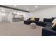 Basement with wet bar and seating area, perfect for entertaining with modern fixtures and a comfortable design at 9197 W Woodard Dr, Lakewood, CO 80227