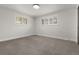 Spacious bedroom with natural light, neutral carpet, and room for personalization at 9197 W Woodard Dr, Lakewood, CO 80227