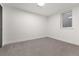 This bedroom features neutral carpet and bright white paint at 9197 W Woodard Dr, Lakewood, CO 80227