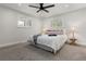 Cozy bedroom with natural light, a ceiling fan, and neutral tones for a relaxing retreat at 9197 W Woodard Dr, Lakewood, CO 80227