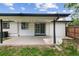 The covered patio has string lights and a sliding glass door to the house at 9197 W Woodard Dr, Lakewood, CO 80227