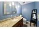 Well-lit bathroom with decorative granite counters, and storage at 85 Yank Way, Lakewood, CO 80228