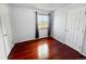 Clean bedroom with bright window, hardwood floors, white doors and neutral paint at 85 Yank Way, Lakewood, CO 80228