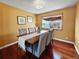 Elegant dining room featuring hardwood floors, comfortable seating, and natural light at 85 Yank Way, Lakewood, CO 80228