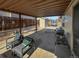 Cozy patio space with grill, seating and a view of the backyard at 85 Yank Way, Lakewood, CO 80228