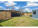 Spacious backyard featuring a lush green lawn and a modern exterior at 6170 Estes Ct, Arvada, CO 80004