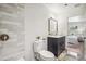 Well-lit bathroom with a modern vanity, stylish fixtures, and a stand-up shower at 6170 Estes Ct, Arvada, CO 80004