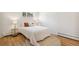Bright bedroom featuring natural light and light colored hardwood floors at 6170 Estes Ct, Arvada, CO 80004