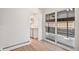 View of the hallway from the kitchen leading to sliding doors to outside at 6170 Estes Ct, Arvada, CO 80004