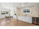 Open kitchen and dining area with hardwood floors and stainless steel appliances at 6170 Estes Ct, Arvada, CO 80004