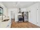 Well-lit kitchen with stainless steel appliances, hardwood floors, and white countertops at 6170 Estes Ct, Arvada, CO 80004