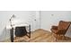 Home office with a large window, desk, and chair with hardwood floors at 6170 Estes Ct, Arvada, CO 80004