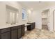 Bathroom featuring double sinks, countertops, and a walk-in shower at 10736 Snowdon St, Parker, CO 80134