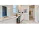 Bathroom with double vanity and walk-in closet at 10736 Snowdon St, Parker, CO 80134