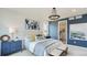 Main bedroom with blue accent wall and en-suite bathroom at 10736 Snowdon St, Parker, CO 80134