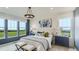 Main bedroom with blue walls and a large window at 10736 Snowdon St, Parker, CO 80134