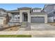 Charming home with stone accents, covered porch, and two-car garage at 10736 Snowdon St, Parker, CO 80134