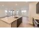 Bright kitchen island that overlooks living area with stainless steel appliances at 10736 Snowdon St, Parker, CO 80134