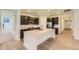 Modern kitchen with stainless steel appliances and a large island at 10736 Snowdon St, Parker, CO 80134