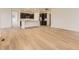 Open floor plan with hardwood floors connecting the living and kitchen areas at 10736 Snowdon St, Parker, CO 80134