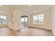 Well-lit living area with hardwood floors and a sliding glass door to the outside at 10736 Snowdon St, Parker, CO 80134