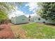 Backyard with a lush green lawn, providing a serene space for outdoor activities and relaxation at 1892 S Fairfax St, Denver, CO 80222