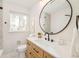 Well-lit bathroom with a vessel sink, modern fixtures, and walk-in shower at 1892 S Fairfax St, Denver, CO 80222