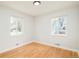 This bedroom has wood floors and two windows at 1892 S Fairfax St, Denver, CO 80222