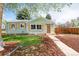 Charming single-story home featuring a well-maintained lawn, shutters, and inviting curb appeal at 1892 S Fairfax St, Denver, CO 80222