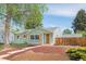 Charming single-story home featuring a well-maintained lawn, shutters, and inviting curb appeal at 1892 S Fairfax St, Denver, CO 80222