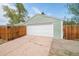 A spacious garage with a white door, offering ample parking and storage space for your vehicles at 1892 S Fairfax St, Denver, CO 80222