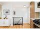 Bright hallway with modern decor, hardwood floors, and staircase view at 1892 S Fairfax St, Denver, CO 80222