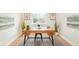 Bright home office featuring a modern desk, hardwood floors, and simple decor at 1892 S Fairfax St, Denver, CO 80222