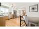 Well-lit kitchen with modern appliances adjacent to dining and living spaces at 1892 S Fairfax St, Denver, CO 80222