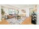 Inviting living room with hardwood floors, plenty of natural light, and minimalist decor at 1892 S Fairfax St, Denver, CO 80222