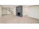Finished basement area showcasing a cozy fireplace and staircase at 1892 S Fairfax St, Denver, CO 80222