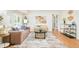 Bright and inviting living room featuring modern decor, hardwood floors and ample natural light at 1892 S Fairfax St, Denver, CO 80222