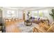 Bright living room and dining area showcasing an open-concept layout and beautiful hardwood floors at 1892 S Fairfax St, Denver, CO 80222