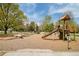 A vibrant playground with slides, swings, and wooden logs for children to explore and enjoy outdoor play at 1892 S Fairfax St, Denver, CO 80222