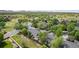 Aerial view of a neighborhood surrounded by lush trees and mountain views at 4116 W 111Th Cir, Westminster, CO 80031