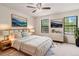 Bedroom featuring two windows with black frames and stylish decor at 4116 W 111Th Cir, Westminster, CO 80031
