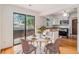 Bright dining area with a modern table, chairs, and a sliding glass door to the outside at 4116 W 111Th Cir, Westminster, CO 80031