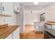 Bright kitchen with butcher block countertops and white cabinets at 4116 W 111Th Cir, Westminster, CO 80031