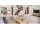 Spacious living room with staircase and plenty of natural light at 4116 W 111Th Cir, Westminster, CO 80031