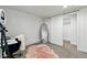 Bedroom has a doorway to a closet, and a pink rug on top of gray carpet at 5390 Rosemary Ln, Denver, CO 80221