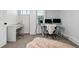 Bedroom with natural light featuring an office setup with two monitors at 5390 Rosemary Ln, Denver, CO 80221