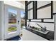 Welcoming entryway with succulents on a shelf and a bright front door with sidelight windows at 5390 Rosemary Ln, Denver, CO 80221