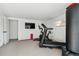 Home gym featuring exercise equipment and television at 5390 Rosemary Ln, Denver, CO 80221