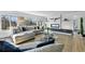 Bright and airy living room showcasing a contemporary design, comfortable seating, and scenic outdoor views at 5390 Rosemary Ln, Denver, CO 80221