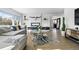 Open concept living room with sleek floors, modern decor, and ample space for entertaining and relaxation at 5390 Rosemary Ln, Denver, CO 80221